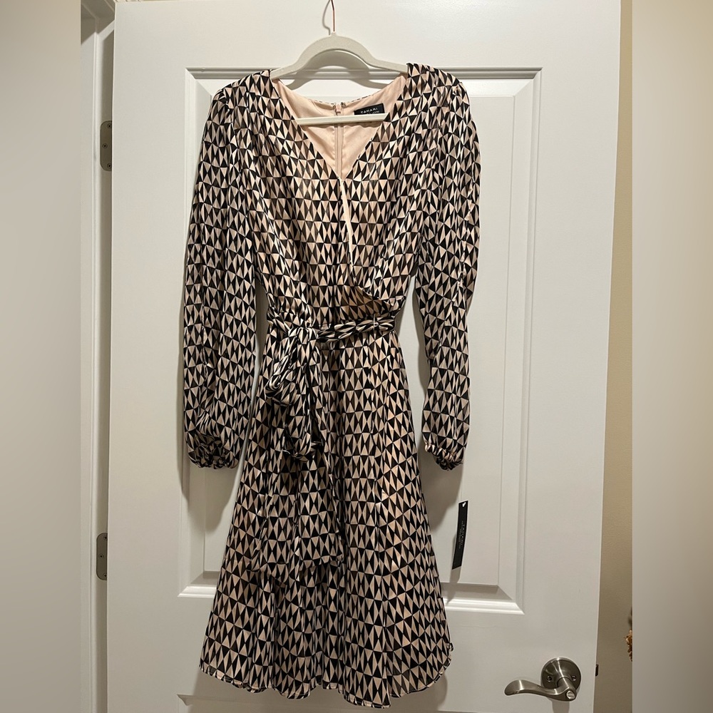 Never worn tags still on wrap with waste tie Tahiti dress